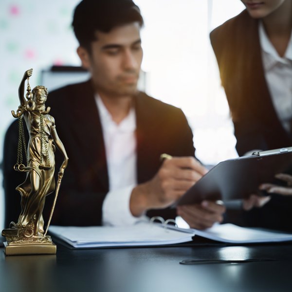 lawtistic-attorney-lawyer-signing-paper Happy therapist woman portrait and checklist for counselling, help and clipboard for support in office. Promoting marketing for therapists.